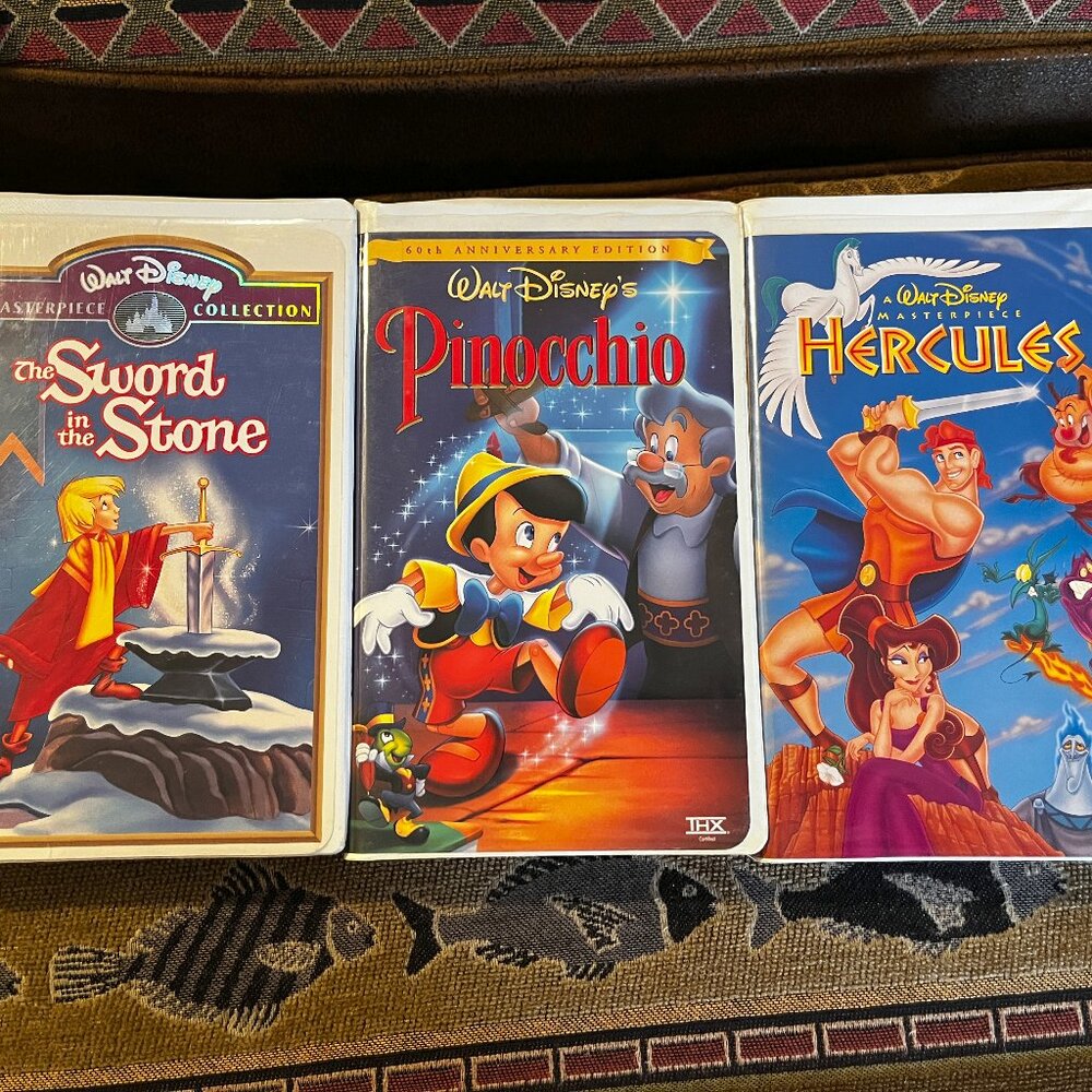 Lot of 2 Disney VHS Tapes, The Sword in the Stone, Pinochio & Hercules
